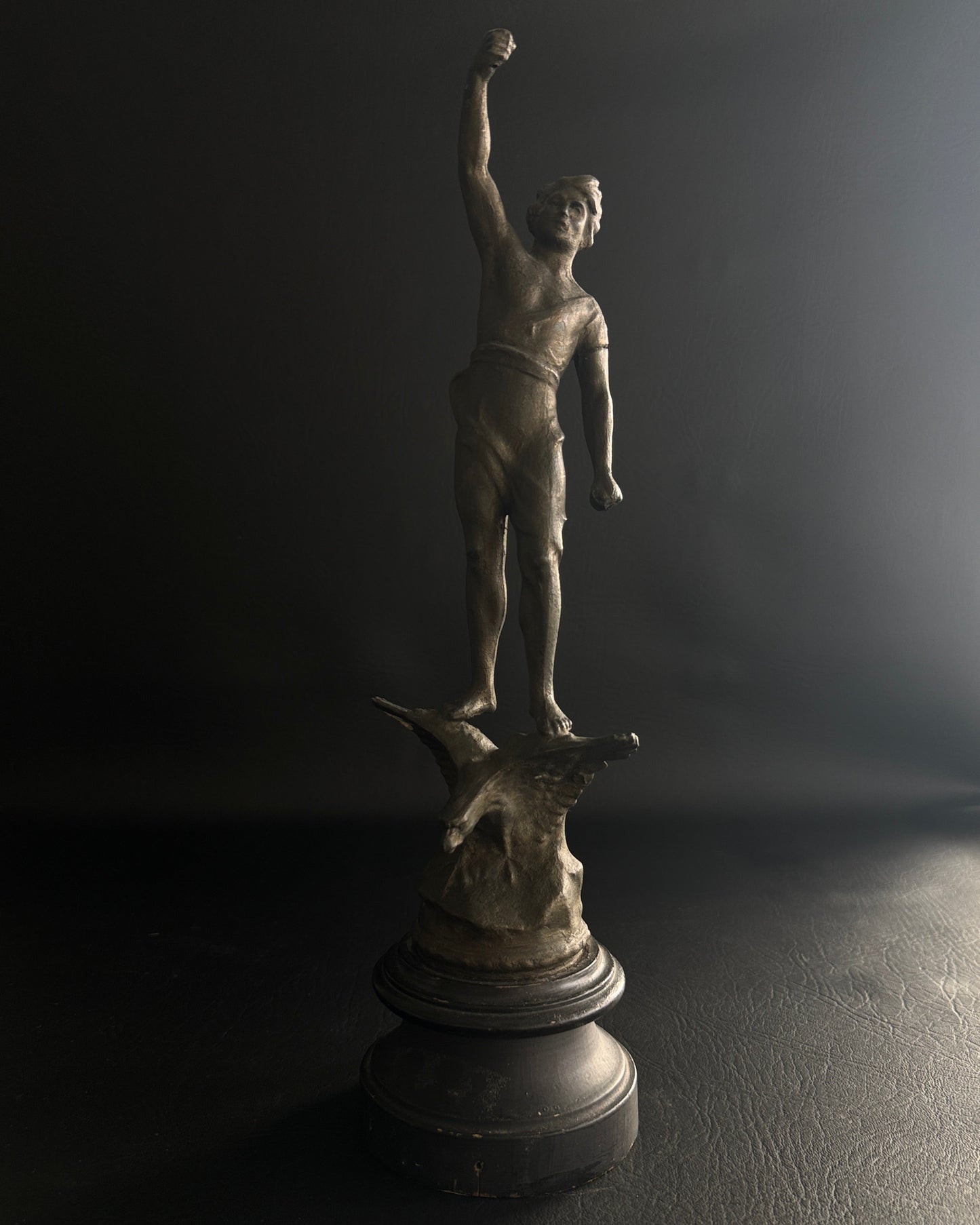 Antique Figural Metal Sculpture of Man Standing on Eagle with Wood Base