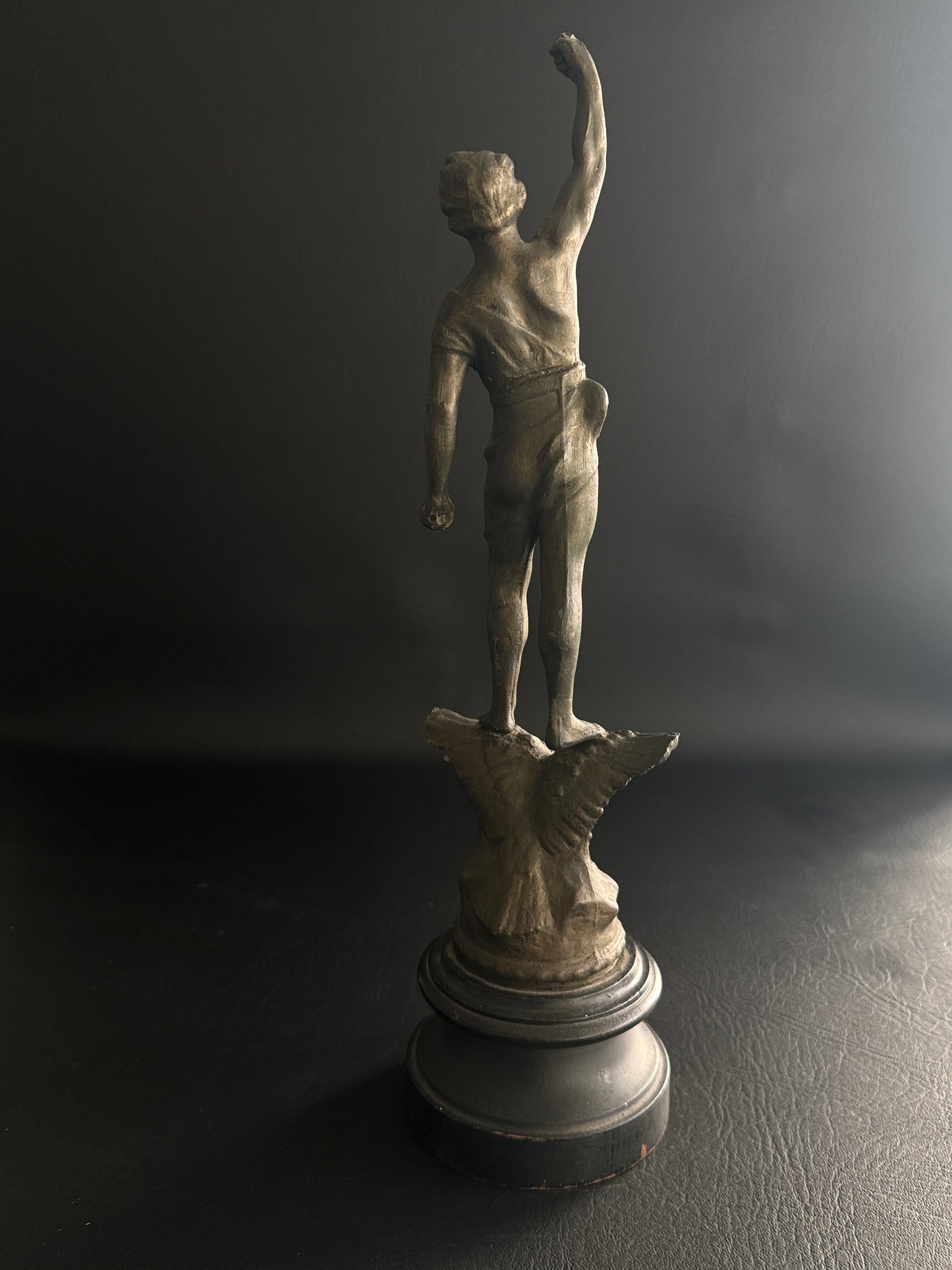Antique Figural Metal Sculpture of Man Standing on Eagle with Wood Base