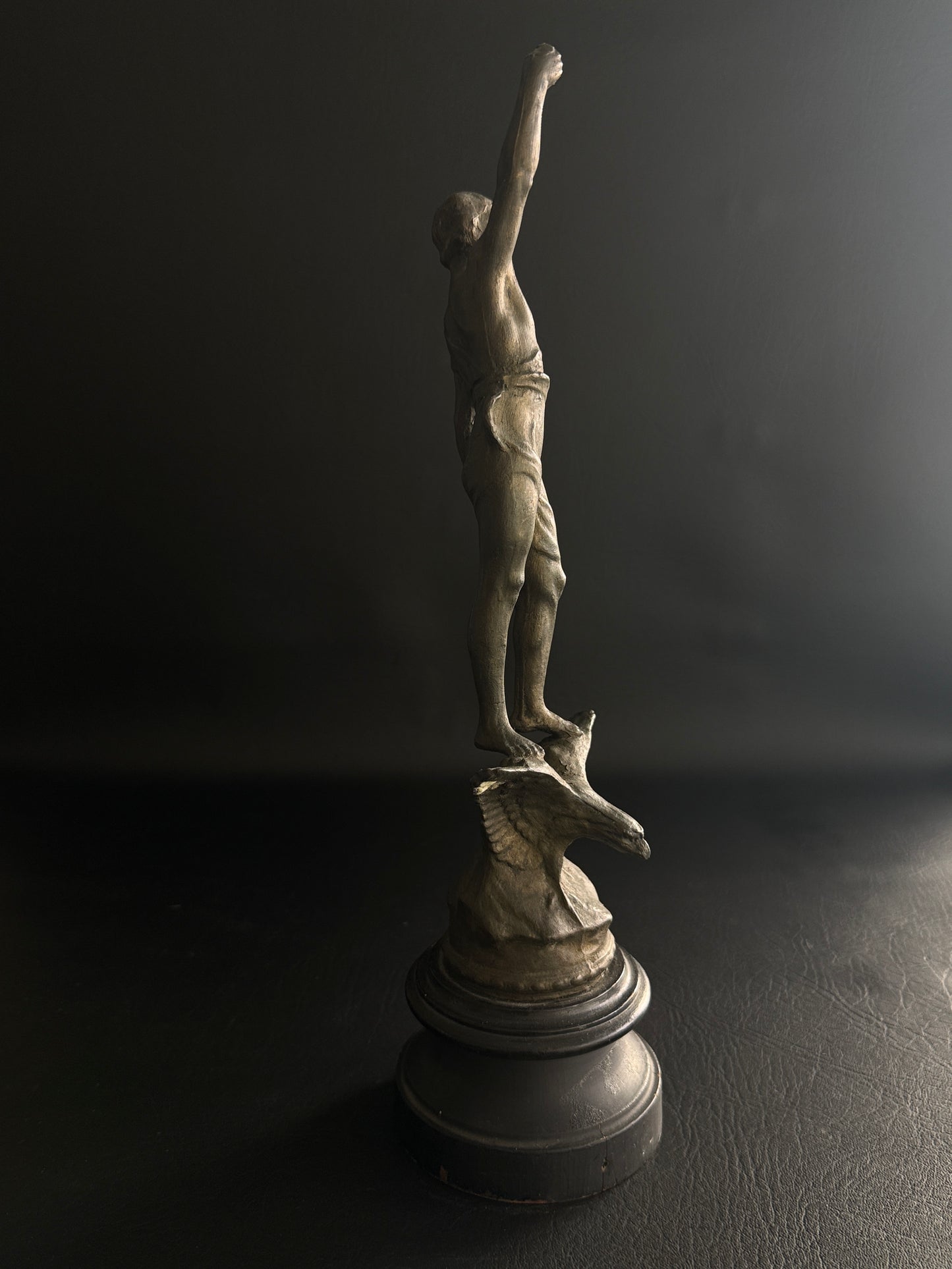 Antique Figural Metal Sculpture of Man Standing on Eagle with Wood Base