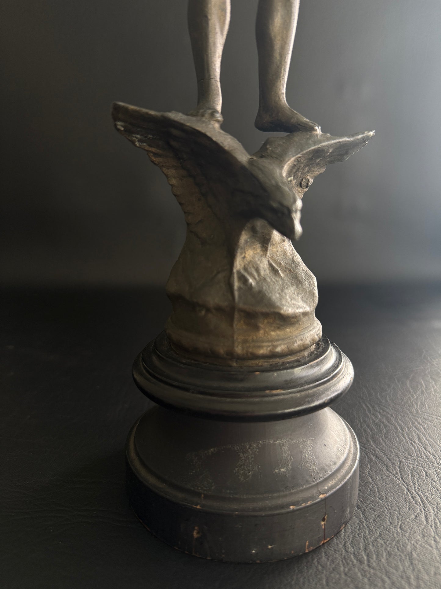 Antique Figural Metal Sculpture of Man Standing on Eagle with Wood Base