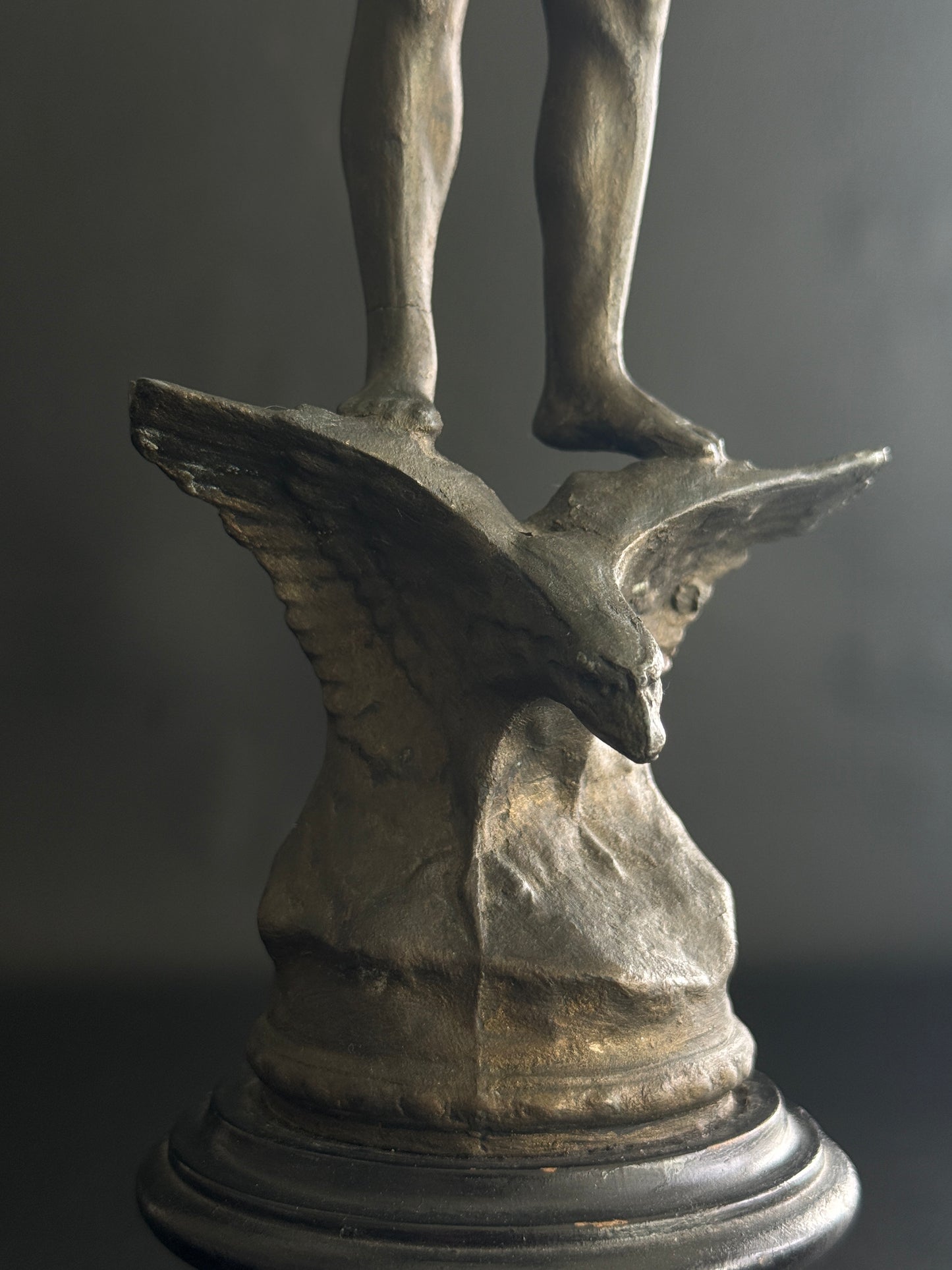 Antique Figural Metal Sculpture of Man Standing on Eagle with Wood Base